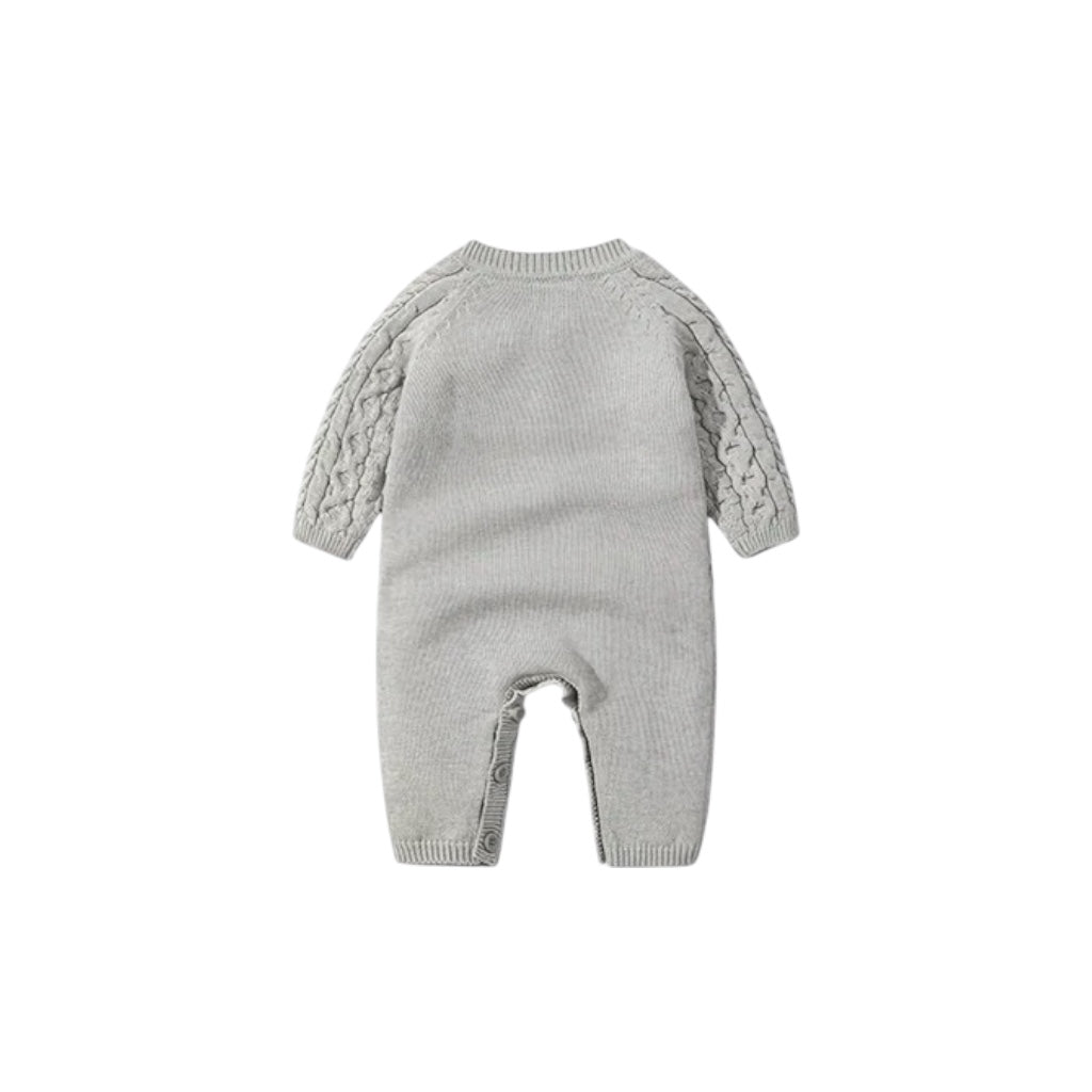 Baby cable knit romper back view with ribbed trim and soft knitted finish