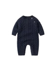 Baby cable knit romper front view with button shoulder fastening and long sleeves