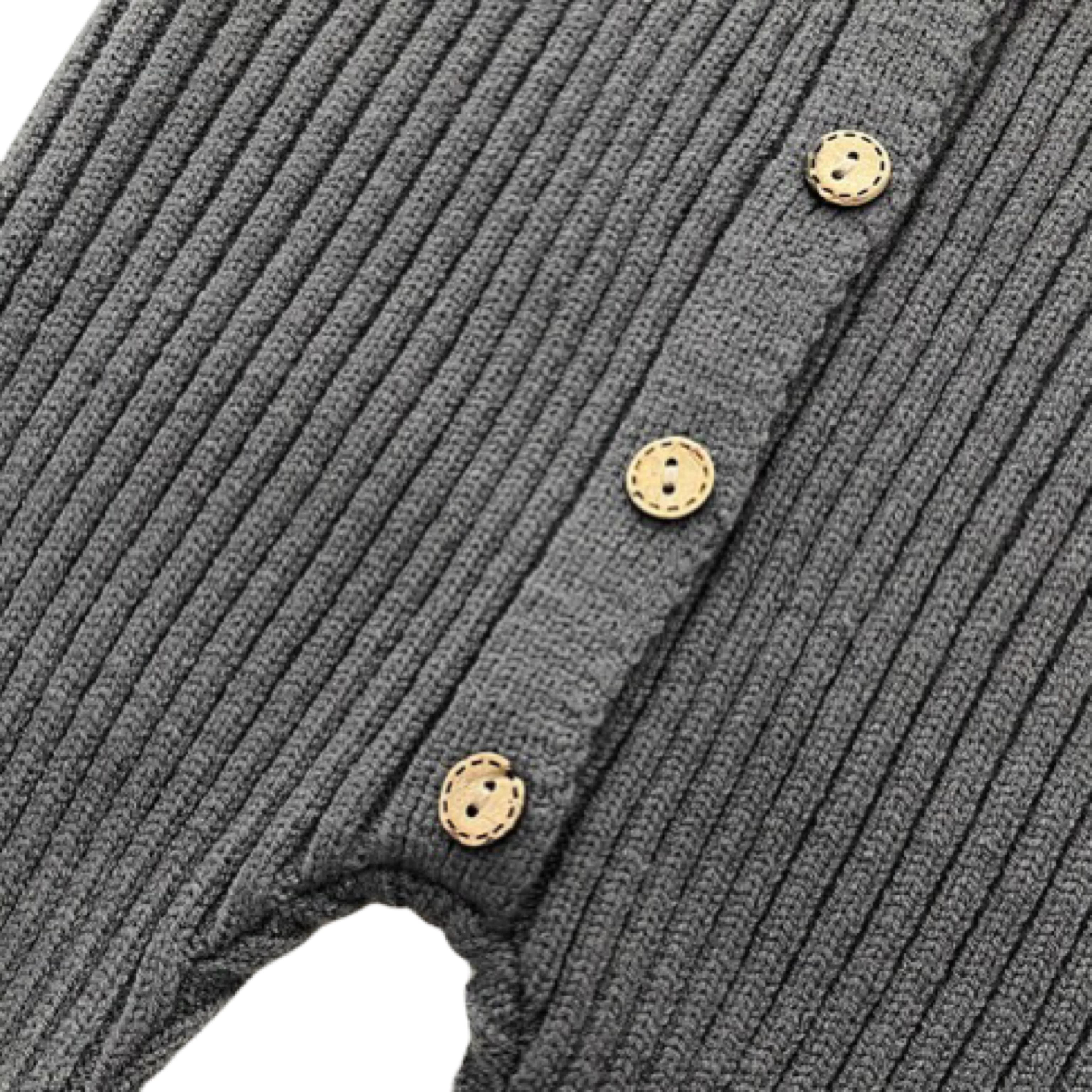 Detailed view of front button design on charcoal ribbed baby romper, soft knit cotton