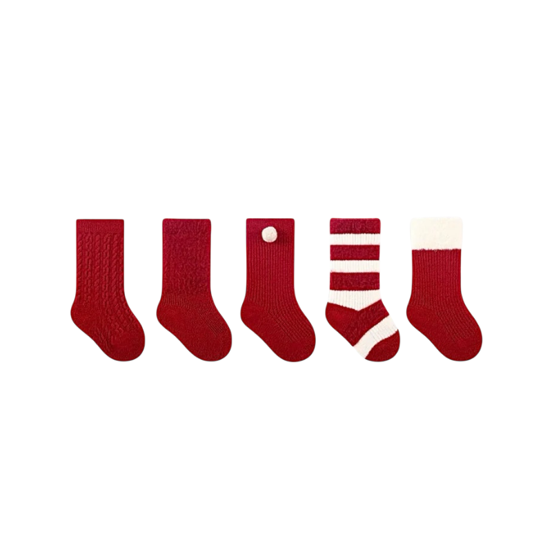 Five pairs of red Christmas baby socks in different styles, including striped, pom pom, and white cuff designs.
