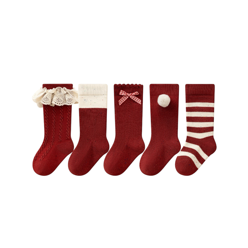 Five pairs of Christmas red baby socks with lace, bow, pom pom, and striped designs made from soft cotton.
