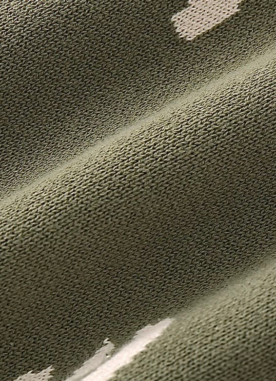Close-up of soft cotton knitted fabric in army green baby romper showing breathable and thick texture.