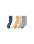 Five pairs of cool neutral cotton socks for children in navy, mustard, sage, and gray — durable and breathable everyday wear.
