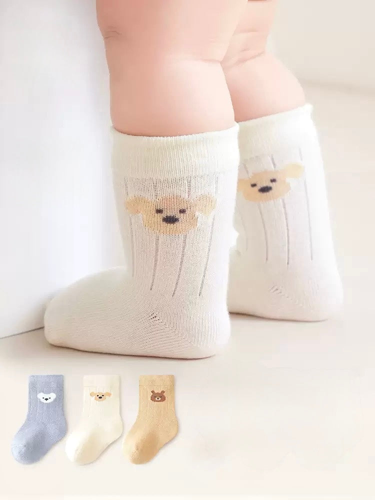 Baby wearing cream bear embroidered cotton socks – soft baby socks UK