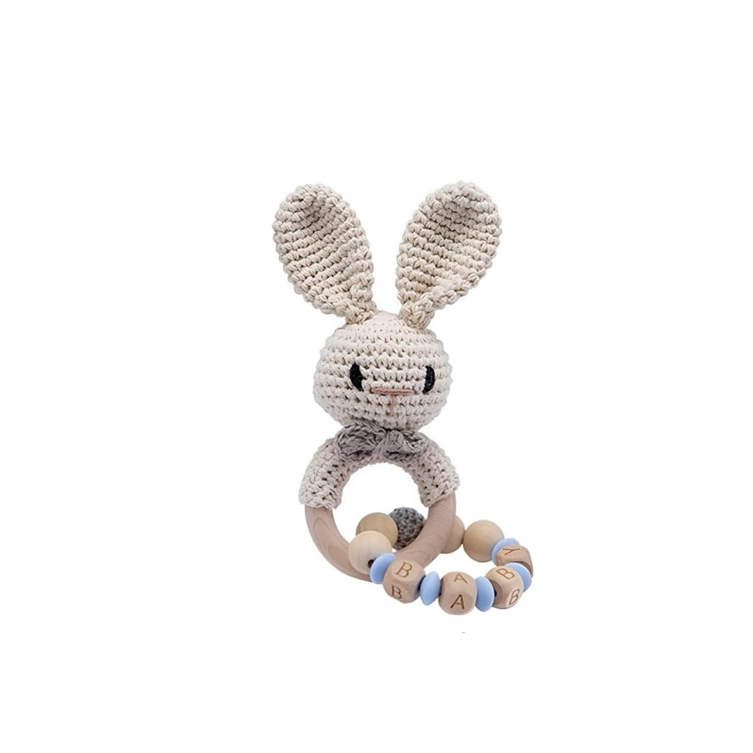 Handmade crochet blue rabbit rattle with chain and natural wooden ring, a sensory newborn baby toy perfect for baby shower gifts and nursery essentials.