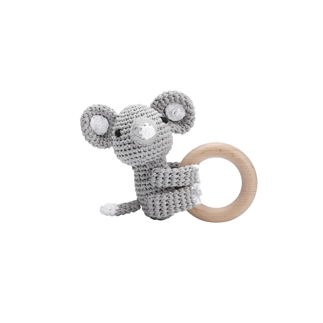 Handcrafted crochet elephant rattle with natural wooden ring, a soft sensory toy for newborn babies and a thoughtful baby shower gift.