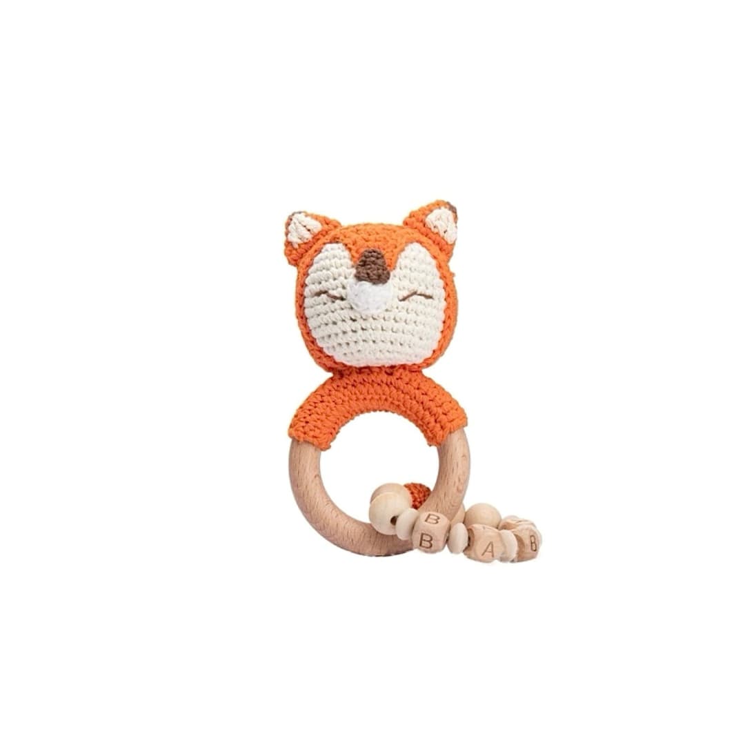 Handmade crochet fox rattle with chain and natural wooden ring, a sensory newborn baby toy perfect for baby shower gifts and nursery essentials.