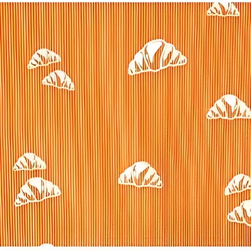 Close-up view of apricot ribbed cotton fabric featuring white croissant pattern, soft breathable knit material for baby clothing.
