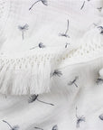 Close-up of dandelion pattern cotton baby blanket, soft breathable newborn blanket made from gentle cotton fabric.