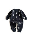 Back view of dark gray moon print baby jumpsuit made of soft cotton knit for toddlers.