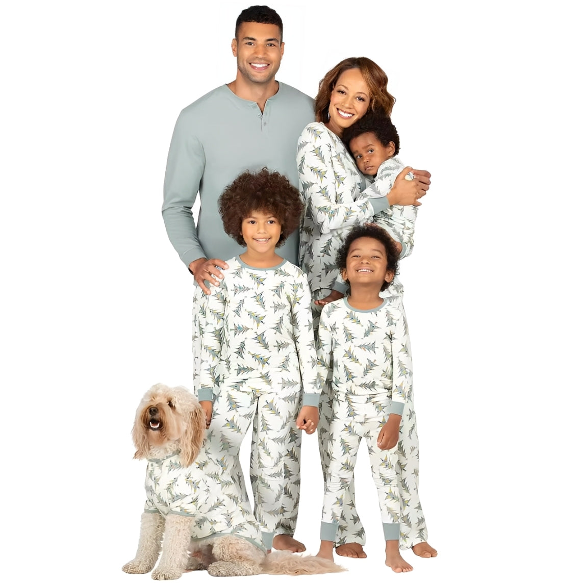 Family in matching Christmas pajamas with tree print