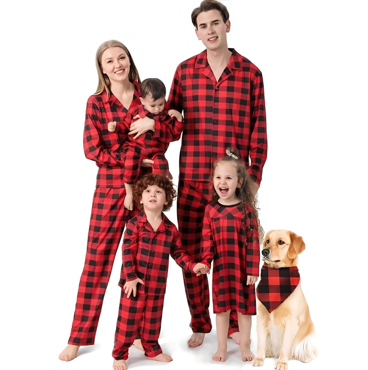 Happy family wearing red and black plaid matching pajamas with children and dog
