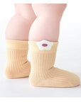 Close-up of floral embroidery detail on cotton baby socks in pastel mix