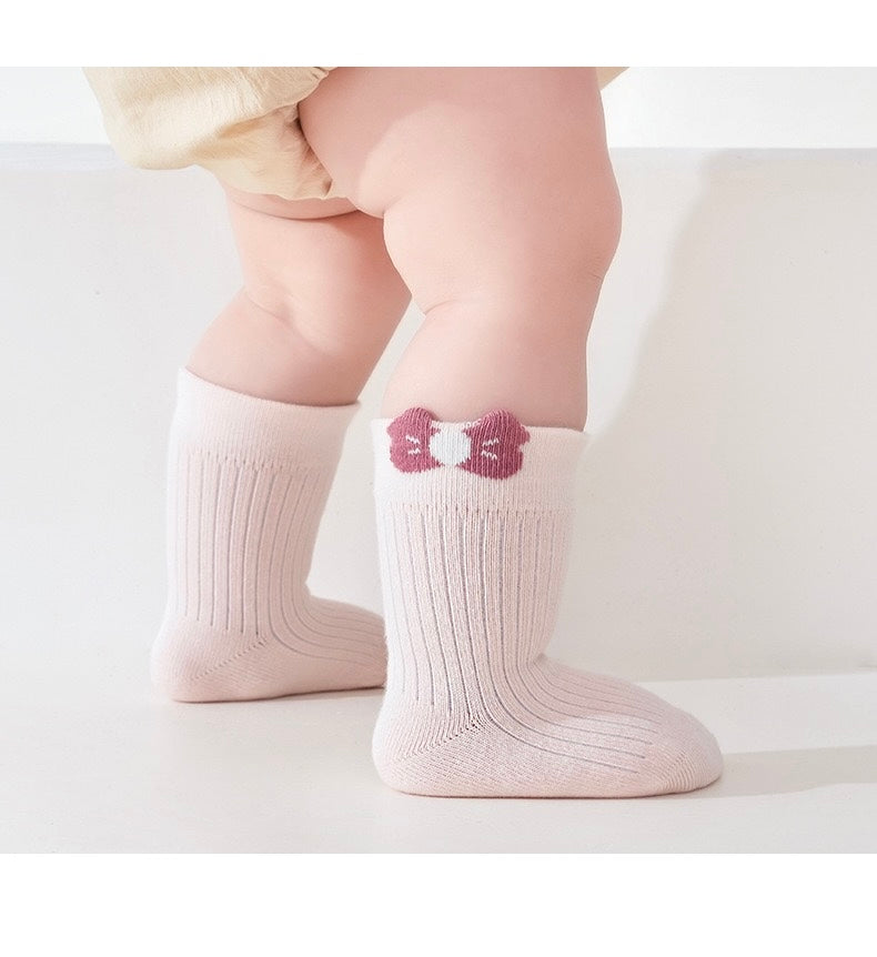 Baby wearing pink floral embroidered socks – cotton socks for babies