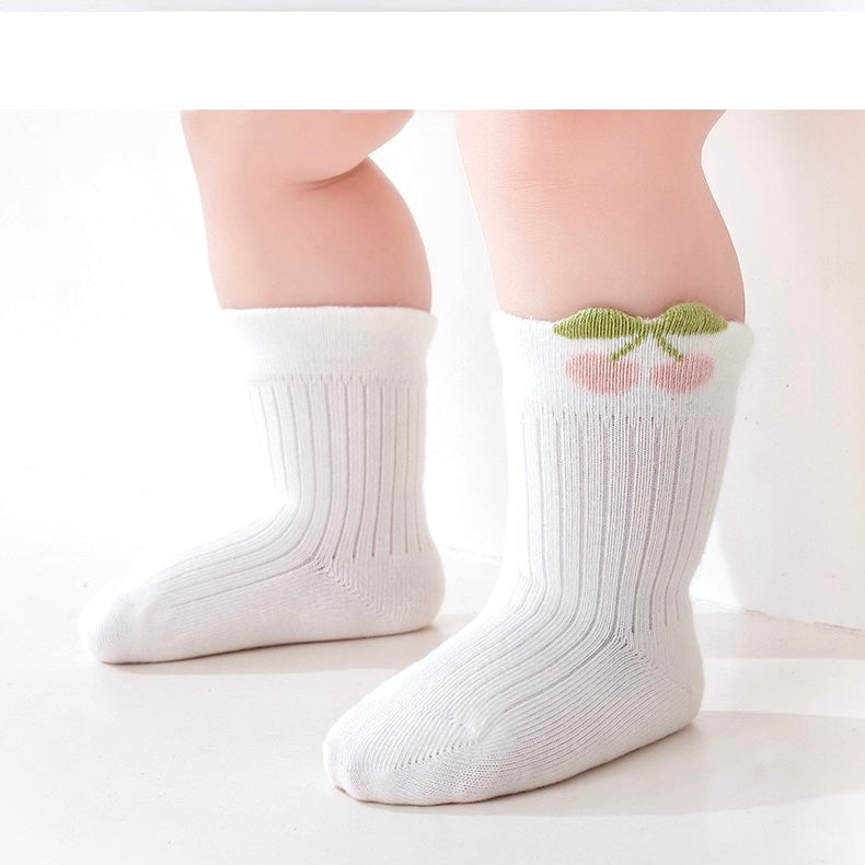 Baby wearing white floral baby socks – breathable cotton with embroidered flower