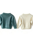 Back view of floral knit baby cardigan with ribbed hem and cuffs