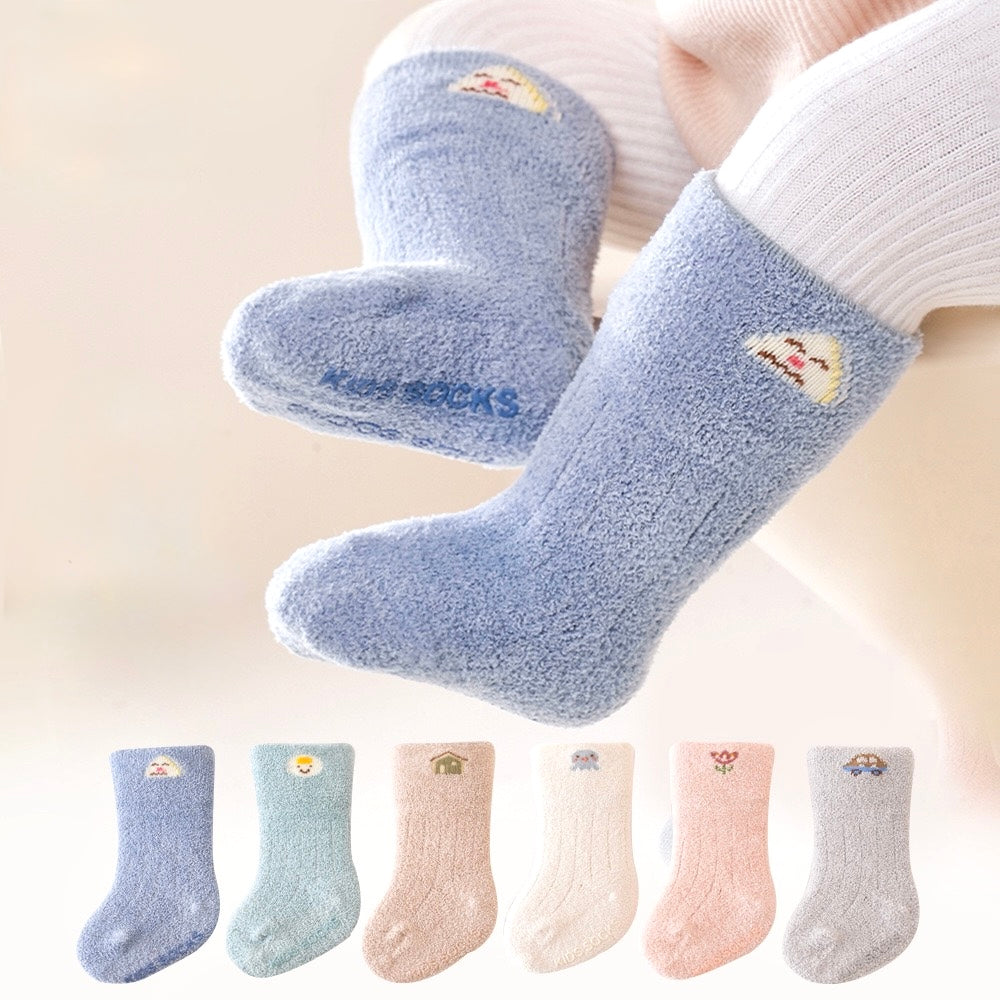 Baby wearing blue fluffy bear embroidered winter socks – soft and warm cotton design