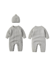 Front and back view of gray cable knit baby romper with hat, showing textured knit pattern and button closure.