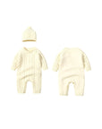 Front and back view of ivory cable knit baby romper with hat, soft cotton knit design for baby comfort.
