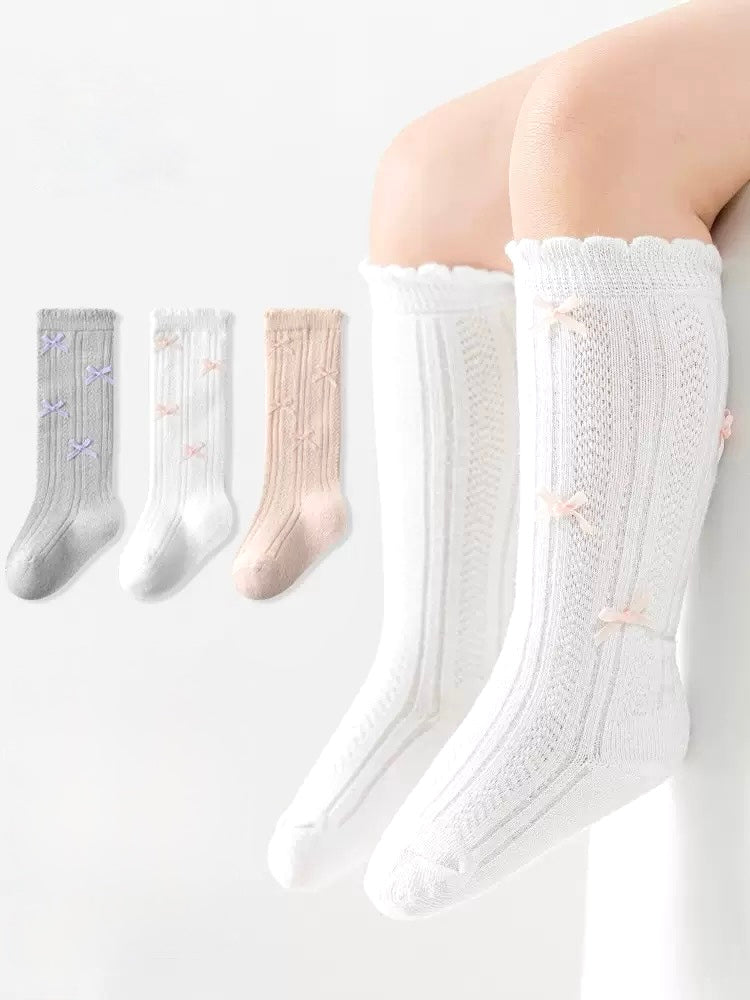 Knit bow knee-high baby socks set in white, grey, and pink – cotton lace-trim design from BabyWonders UK