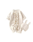 Light apricot knitted baby romper with ruffle buttons and matching hat, warm and breathable baby outfit.