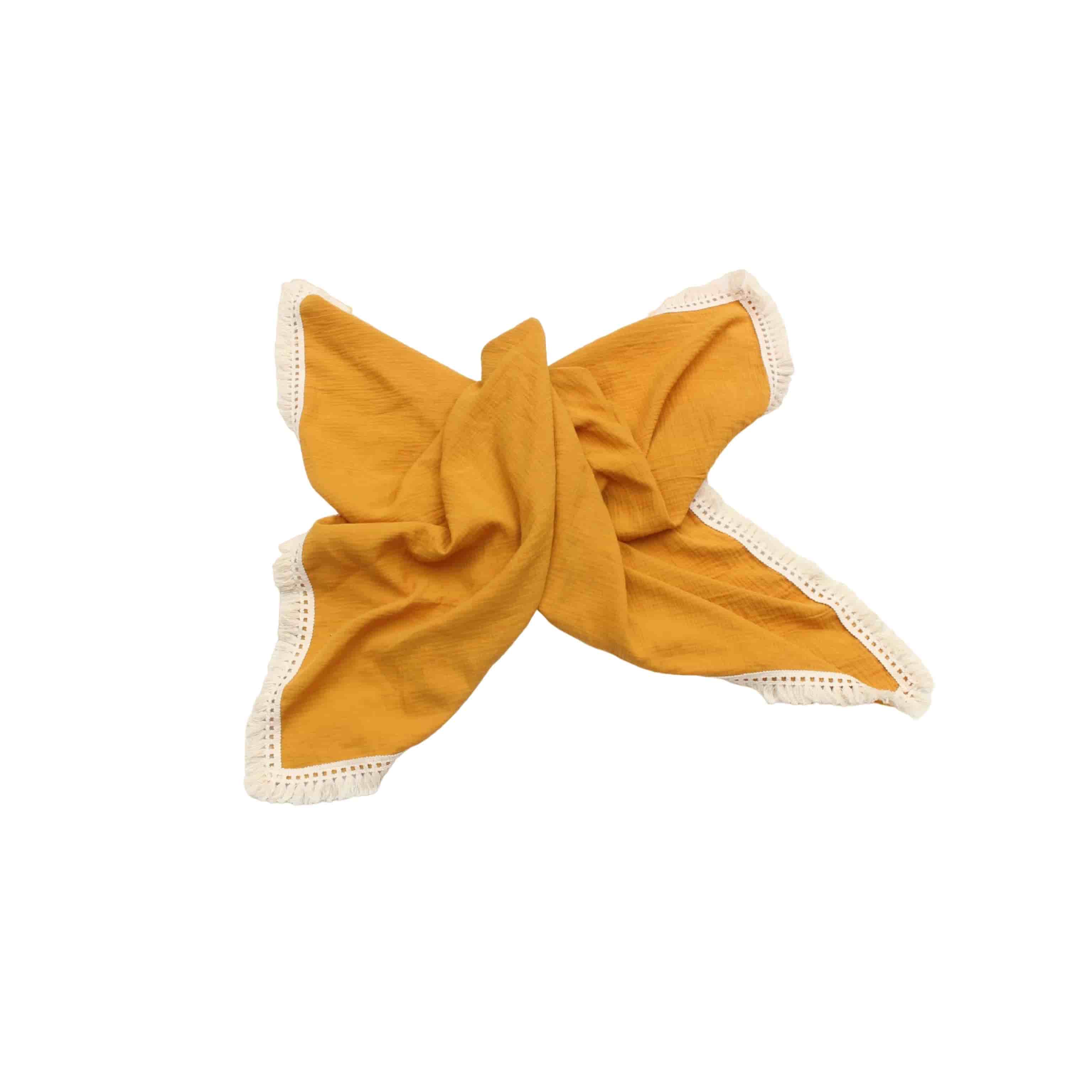 Orange cotton baby blanket with tassel trim, soft breathable newborn blanket for cot, stroller and nursery use.