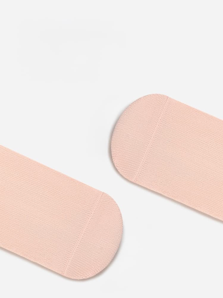 Pink heel and toe detail of baby cotton socks showing fine stitching