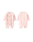 Front and back view of pink embroidered knit baby romper for newborn girls.
