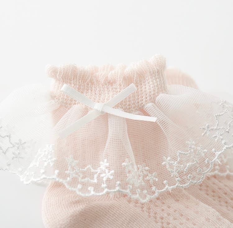 Pink lace frill baby socks with ribbon bow and floral embroidery
