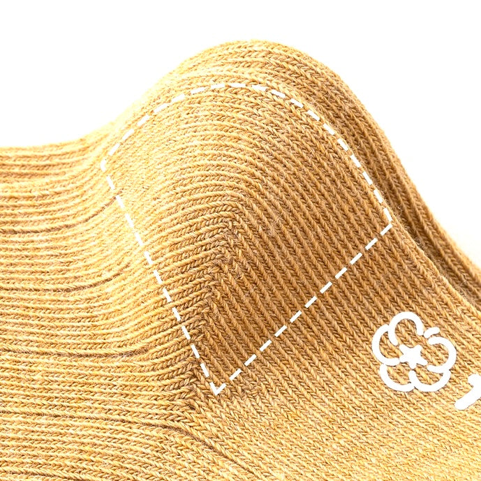 Detailed close-up of reinforced heel stitching on kids’ cotton socks for extra comfort and durability.