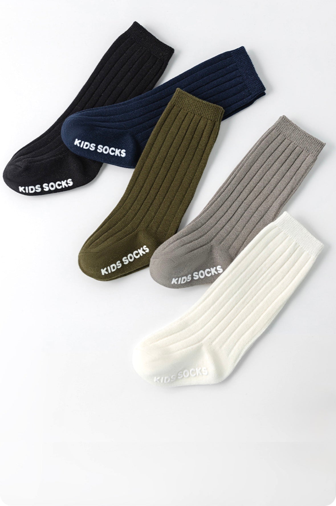 Four pairs of kids&#39; socks in black, green, gray, and white on a white background.