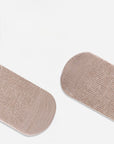 Pair of beige socks on a white background