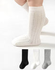 White knee-high socks with a plain background