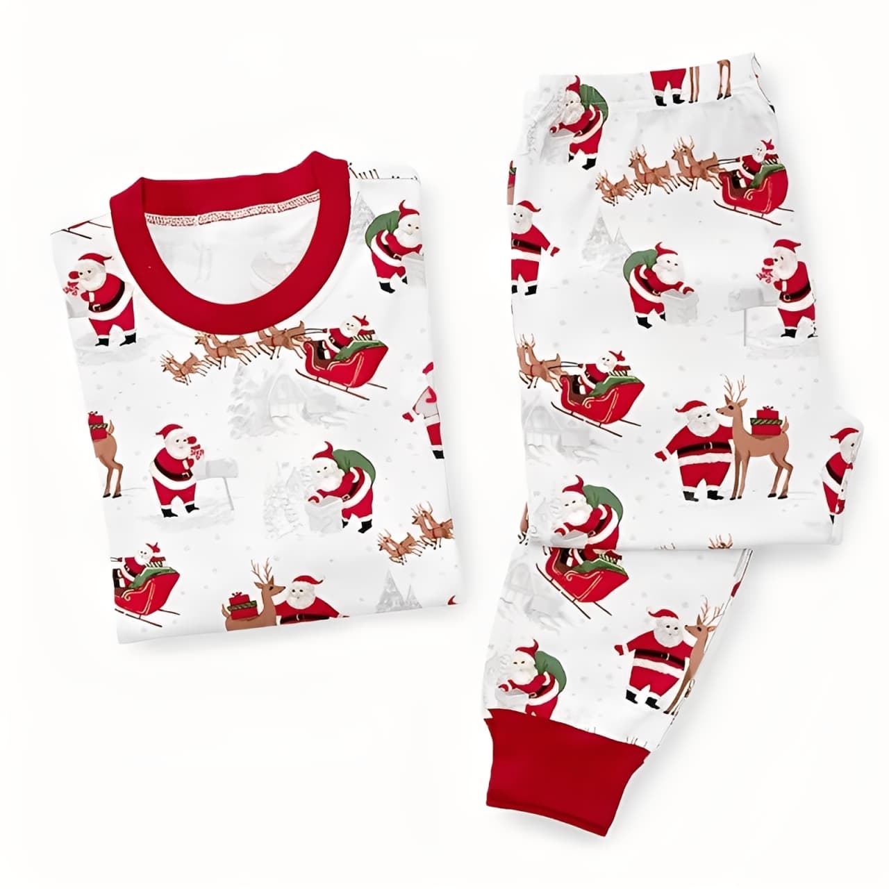 Flat lay of matching Christmas pajamas set with Santa Claus and reindeer print, red cuffs.