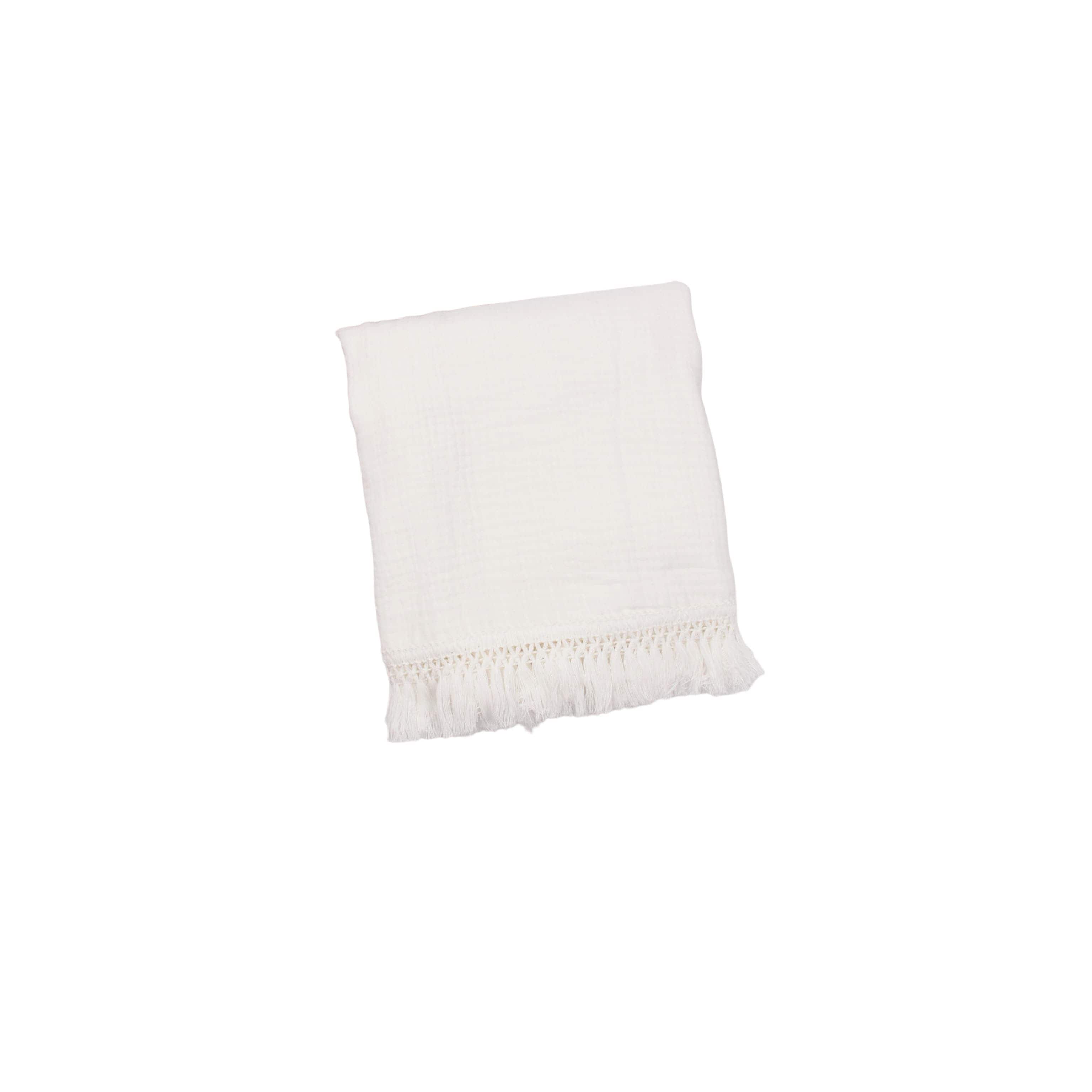 Snow white cotton baby blanket with tassel edges, soft breathable newborn blanket for nursery, cot and stroller use.