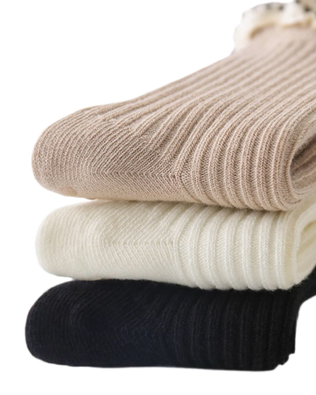 Stack of baby ruffle cotton socks in beige, white, and black colors