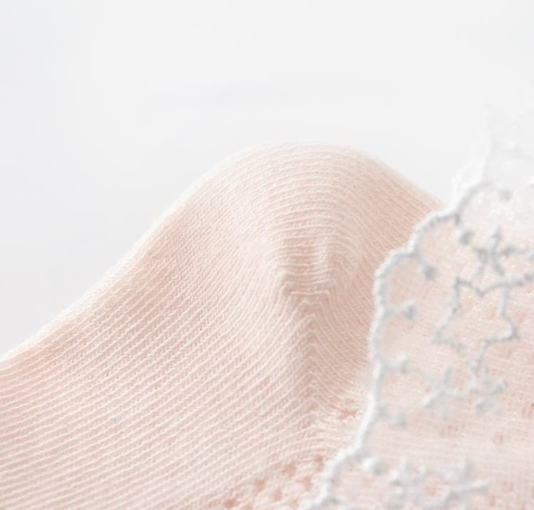 Soft cotton toe area of baby lace socks with fine stitching