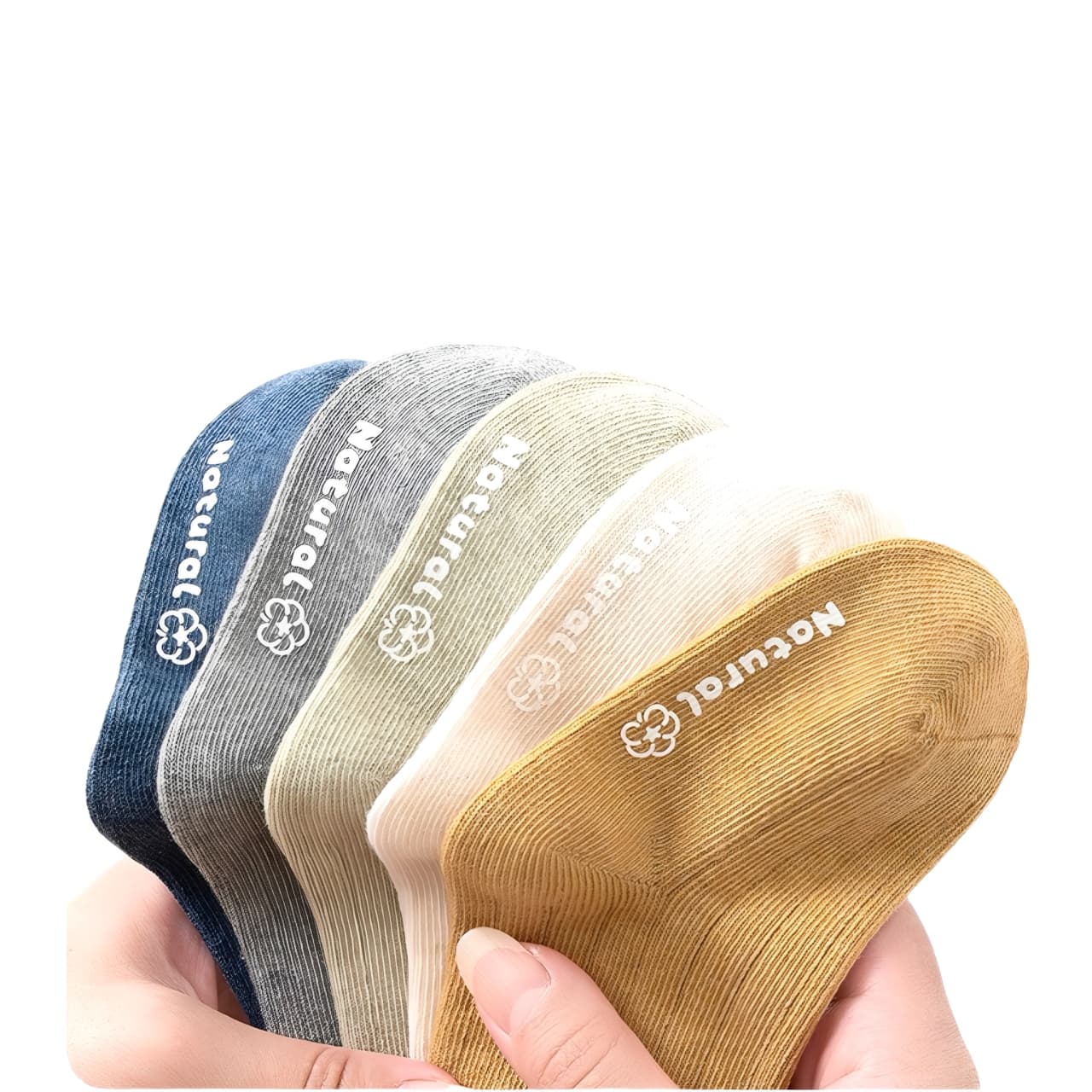 Close-up of five pairs of children’s cotton socks in hand showing soft ribbed texture and elastic stretch.