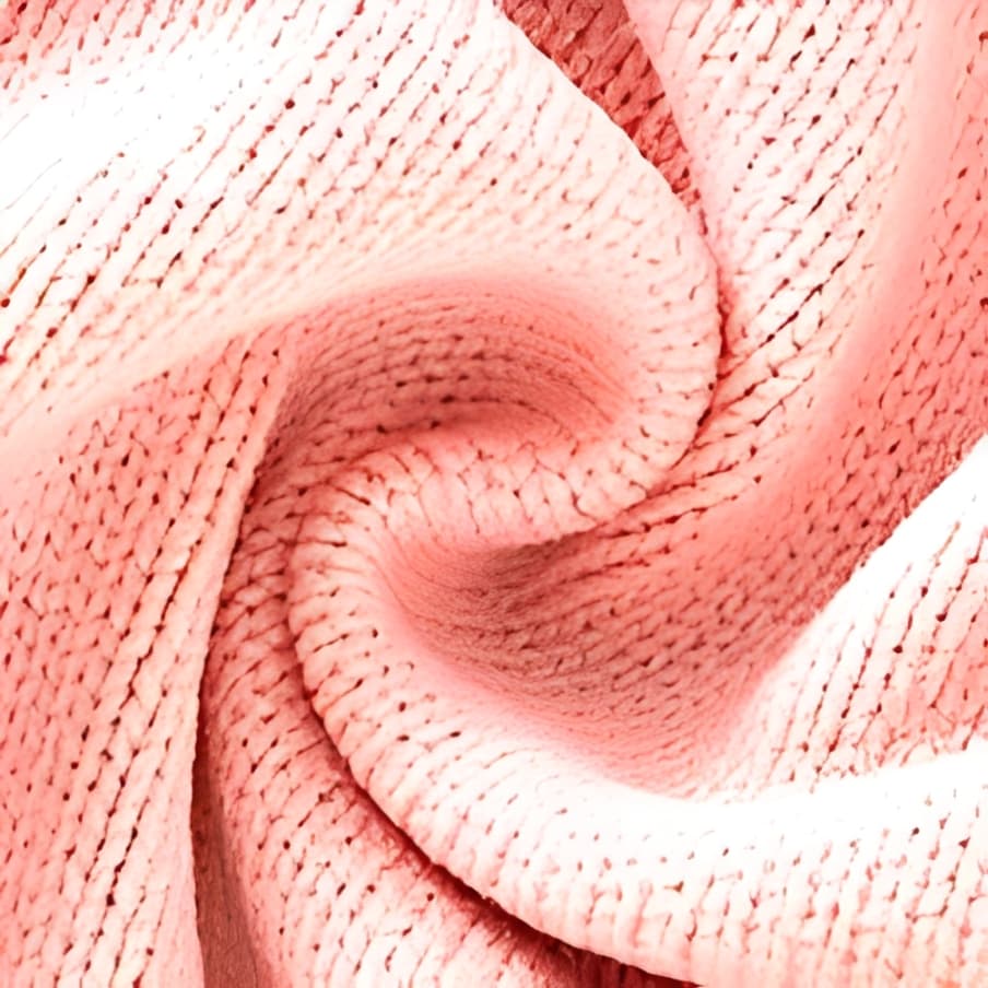 Close-up texture of soft pink knitted fabric for baby romper