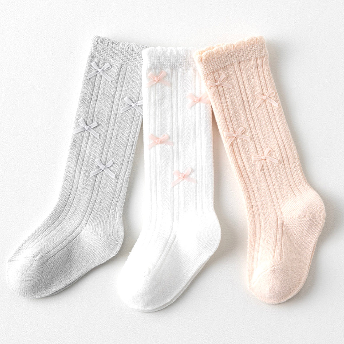 Folded cotton knit baby socks in neutral tones – soft and elegant design