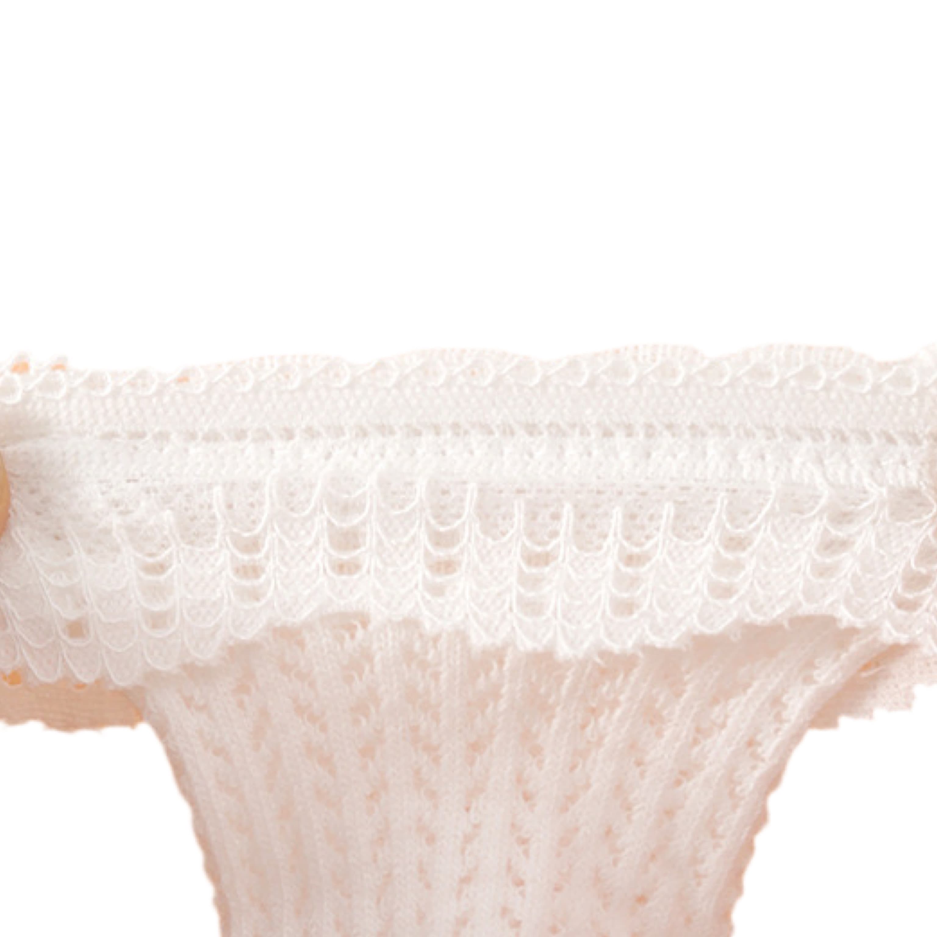 Elastic and stretchable lace-knit top of baby socks ensuring comfort and fit.