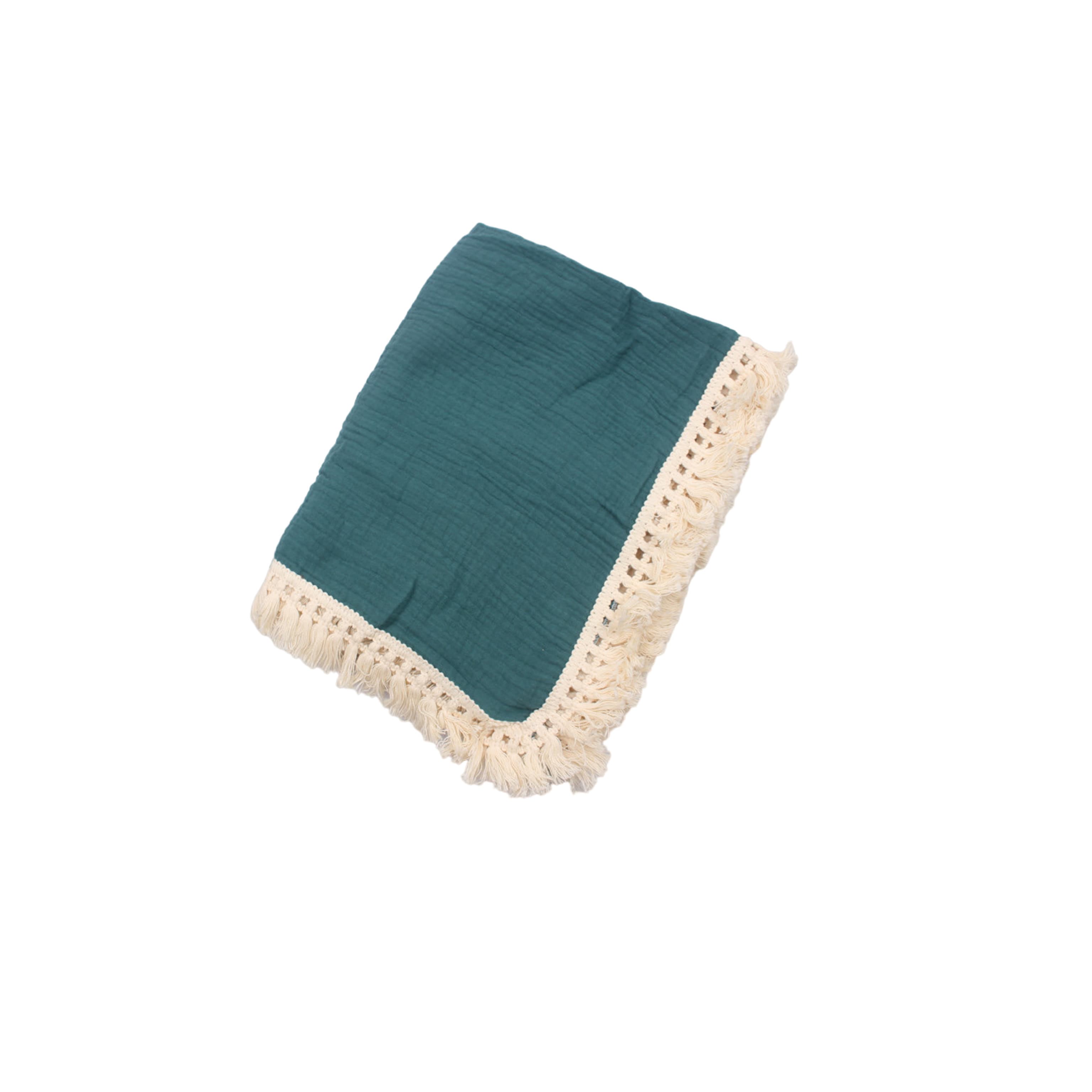 Turquoise cotton baby blanket with tassel edges, soft breathable newborn blanket for nursery, cot and stroller use.
