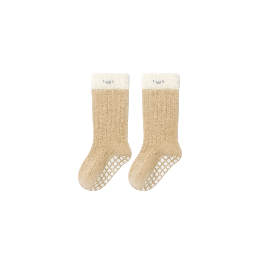 Beige baby socks with ribbed cotton texture and anti-slip sole