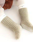 Baby wearing khaki two-tone anti-slip socks with ribbed cotton knit – BabyWonders UK
