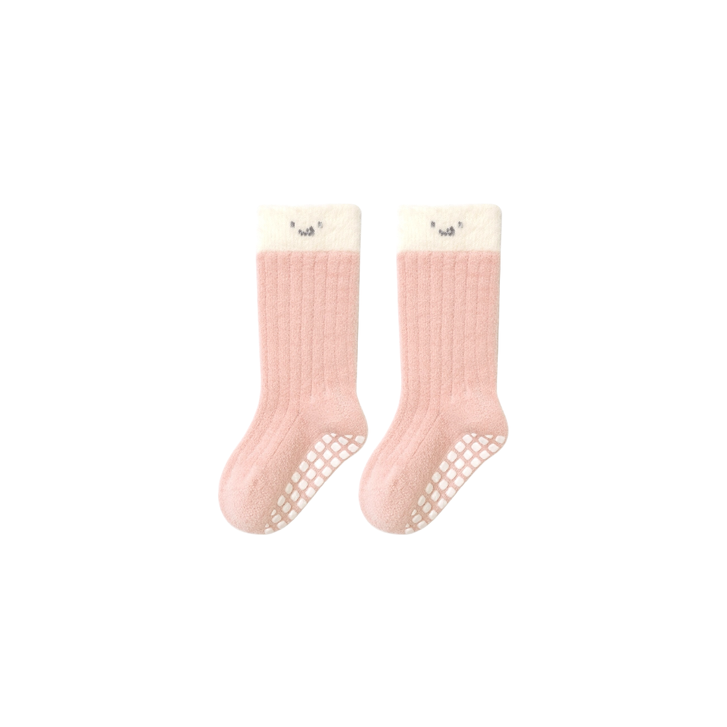 Pink ribbed cotton baby socks with soft white cuff and non-slip bottom