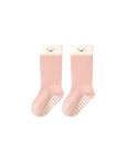 Pink ribbed cotton baby socks with soft white cuff and non-slip bottom