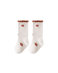 White daisy frill baby socks with embroidered floral design and ribbed texture