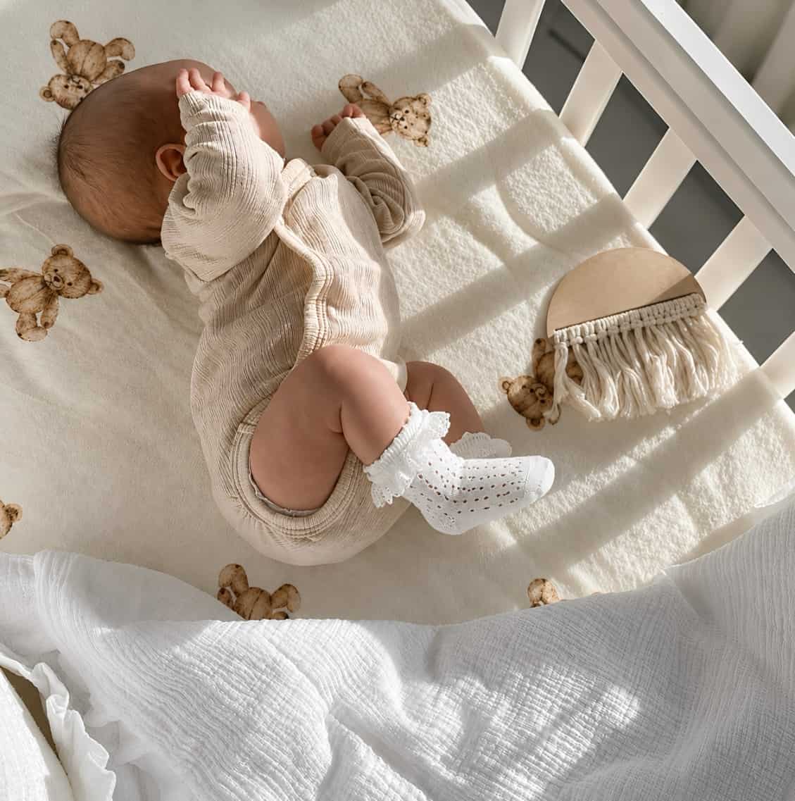 Baby wearing white lace ruffle knee-high cotton crochet socks with soft breathable comfort for newborns and toddlers
